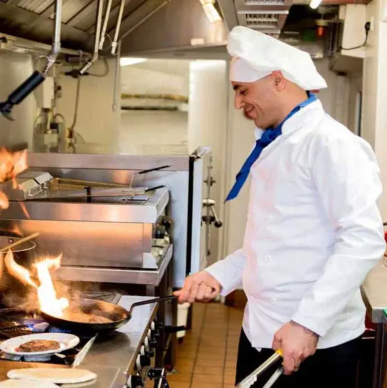 Jordan Oaks Chef Created Meals, chef frying a dish.