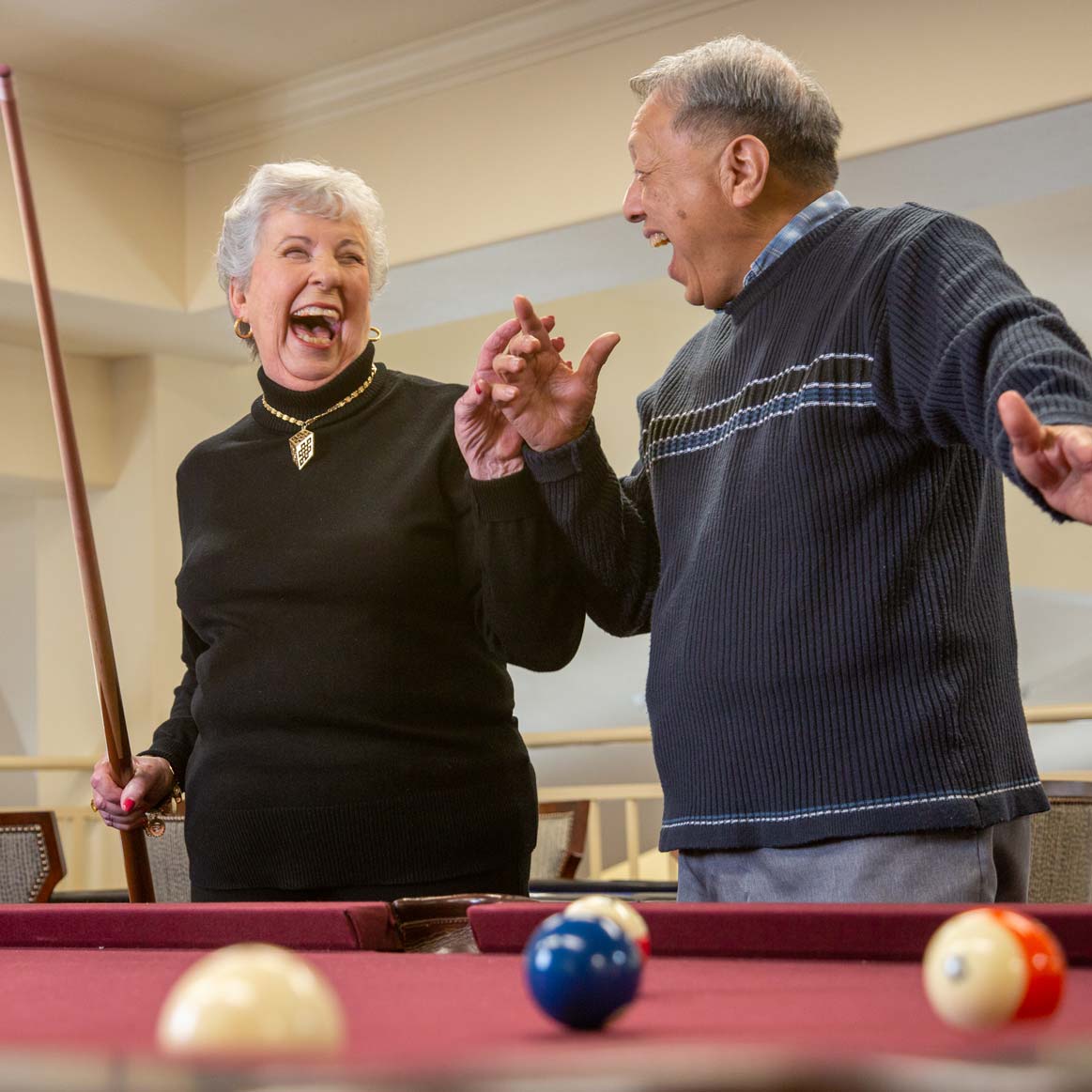Residents playing billiards at Jordan Oaks